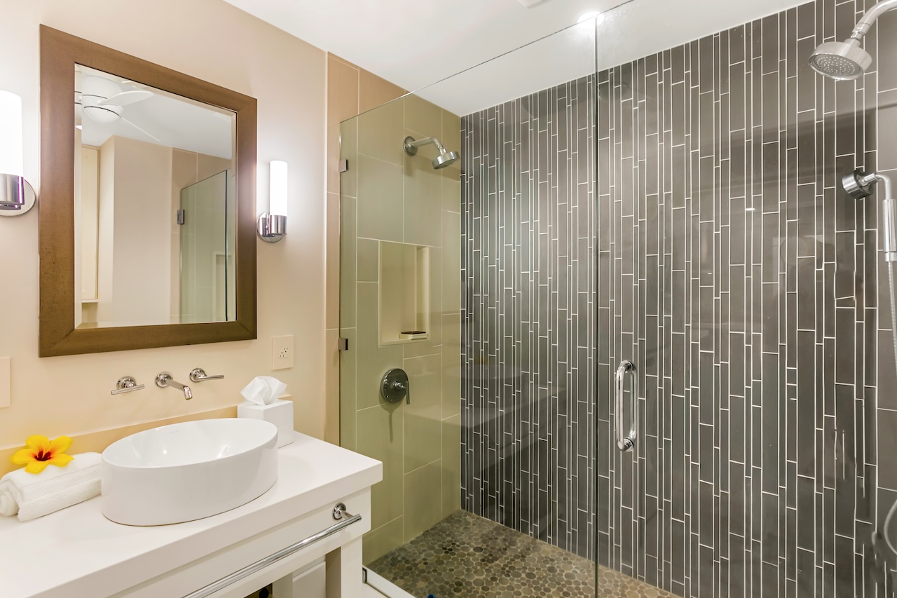 2330 Ho'ohu Road, Unit 16 Koloa, HI 96756 - Photo 16 of 29 a bathroom with a sink shower and a mirror