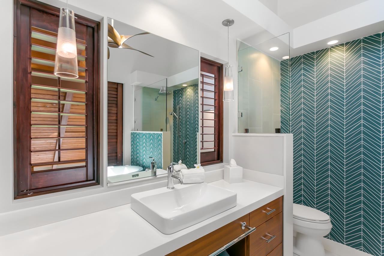 2330 Ho'ohu Road, Unit 16 Koloa, HI 96756 - Photo 22 of 29 a bathroom with a sink and a mirror