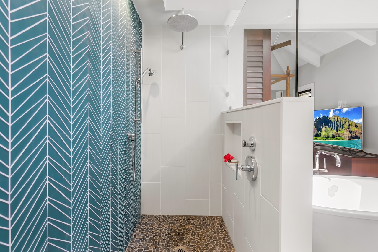 2330 Ho'ohu Road, Unit 16 Koloa, HI 96756 - Photo 23 of 29 a bathroom with a sink and a shower curtain