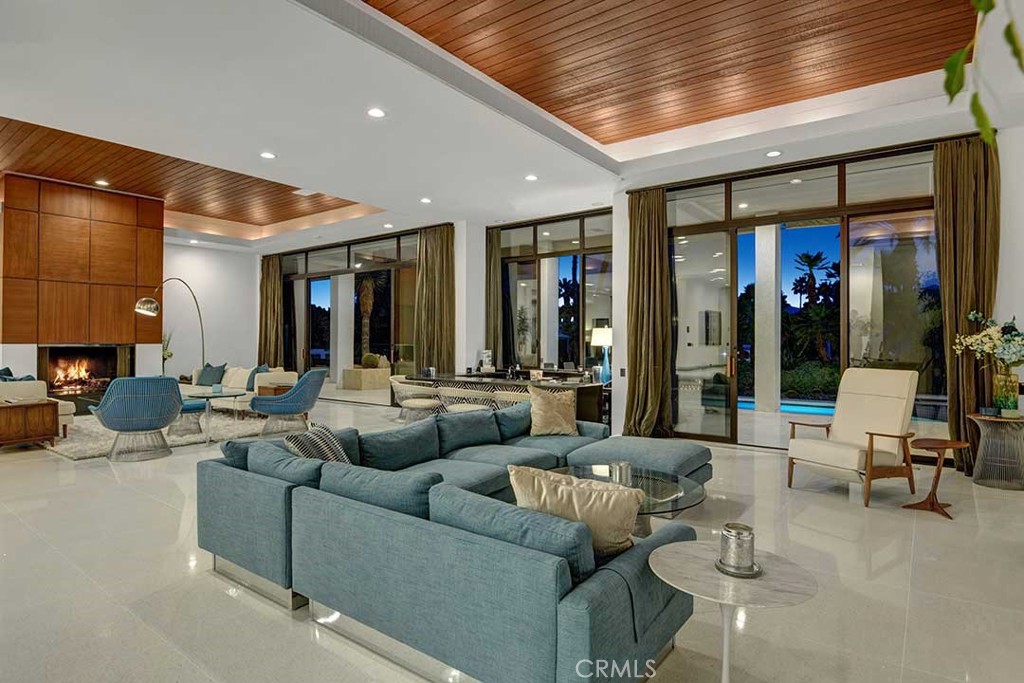 70955 Tamarisk Lane Rancho Mirage, CA 92270 - Photo 12 of 42 a living room with furniture and large windows
