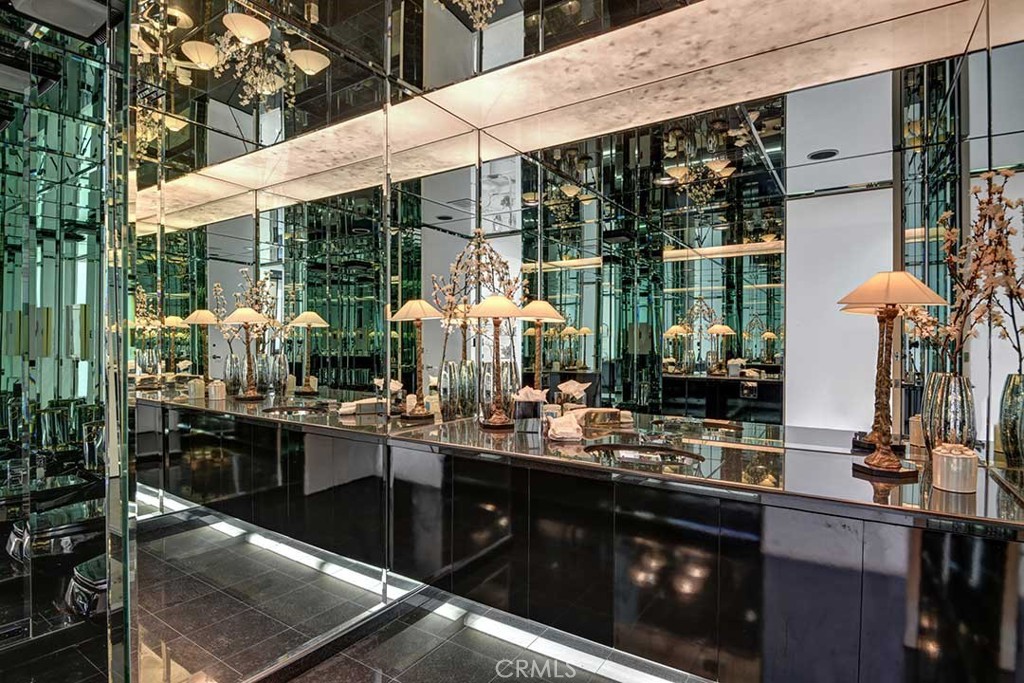 70955 Tamarisk Lane Rancho Mirage, CA 92270 - Photo 21 of 42 a kitchen with a sink and wooden cabinets