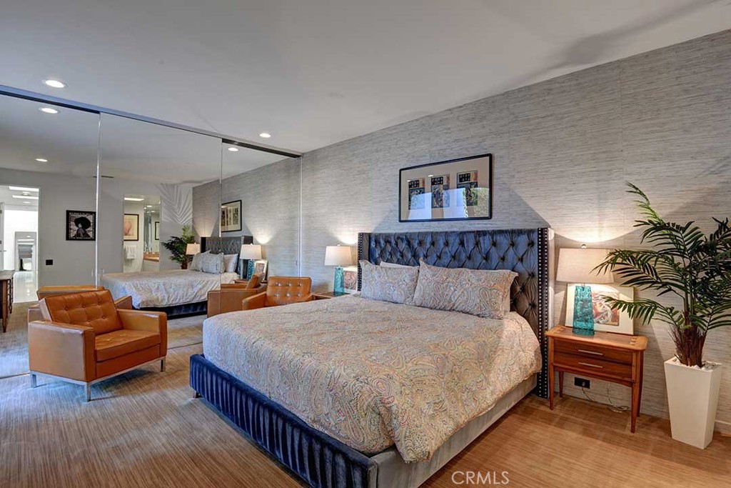 70955 Tamarisk Lane Rancho Mirage, CA 92270 - Photo 26 of 42 a spacious bedroom with a bed and a couch