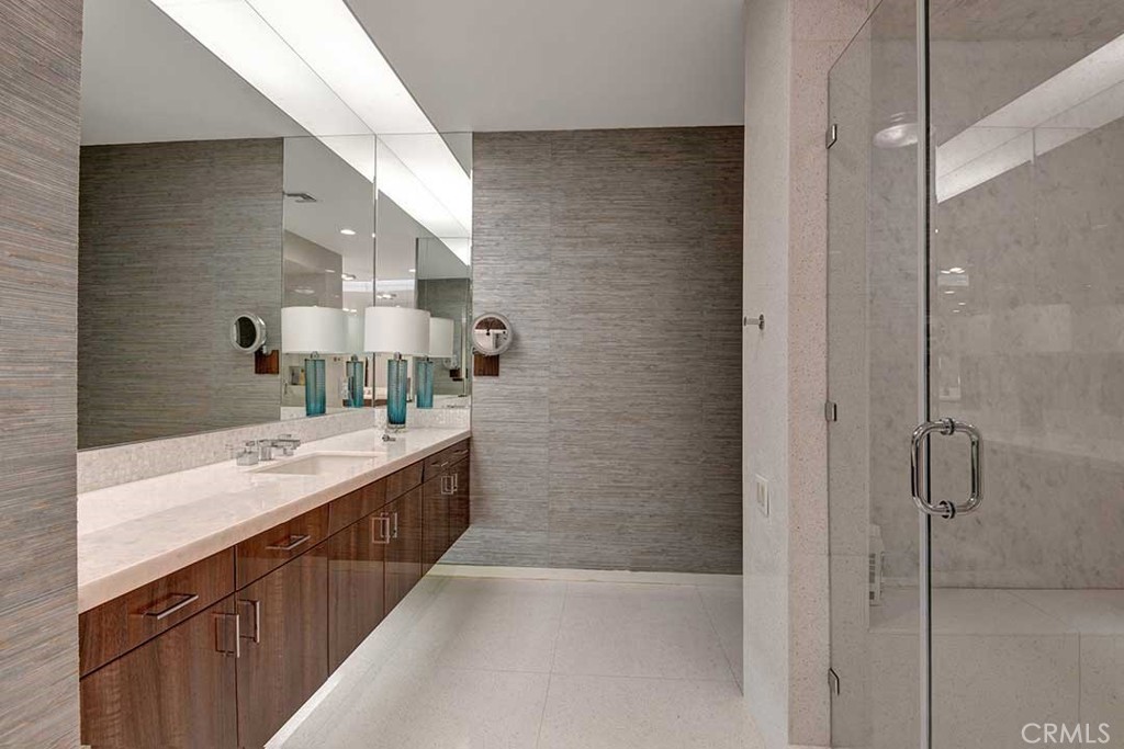 70955 Tamarisk Lane Rancho Mirage, CA 92270 - Photo 34 of 42 a bathroom with a double vanity sink mirror and shower