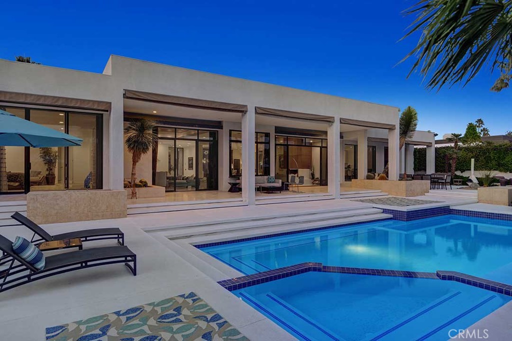 70955 Tamarisk Lane Rancho Mirage, CA 92270 - Photo 40 of 42 a view of a building with seating area