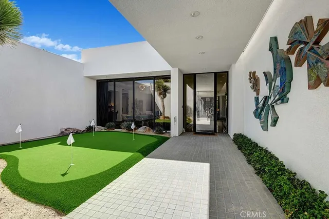 a view of a house with backyard and porch