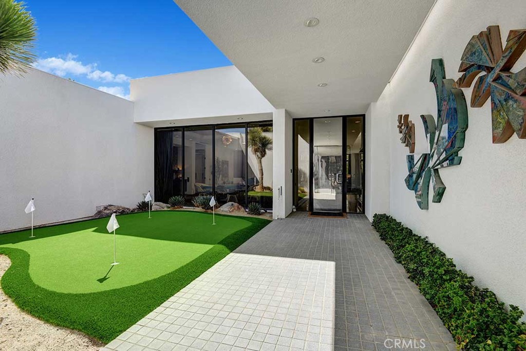 70955 Tamarisk Lane Rancho Mirage, CA 92270 - Photo 7 of 42 a view of a house with backyard and porch