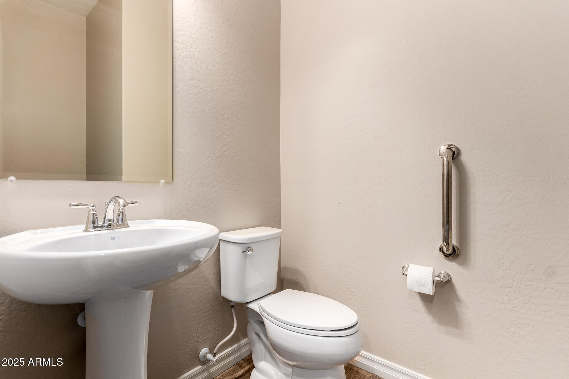 18190 North Stonegate Road Maricopa, AZ 85138 - Photo 7 of 27 a bathroom with a sink toilet and a mirror