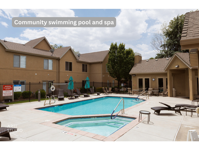 6761 950 East Midvale, UT 84047 - Photo 31 of 44 Community swimming pool and integrated spa with surrounding lounge areas, shaded by mature trees