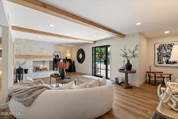 a kitchen with stainless steel appliances kitchen island granite countertop a stove a sink a refrigerator and a microwave