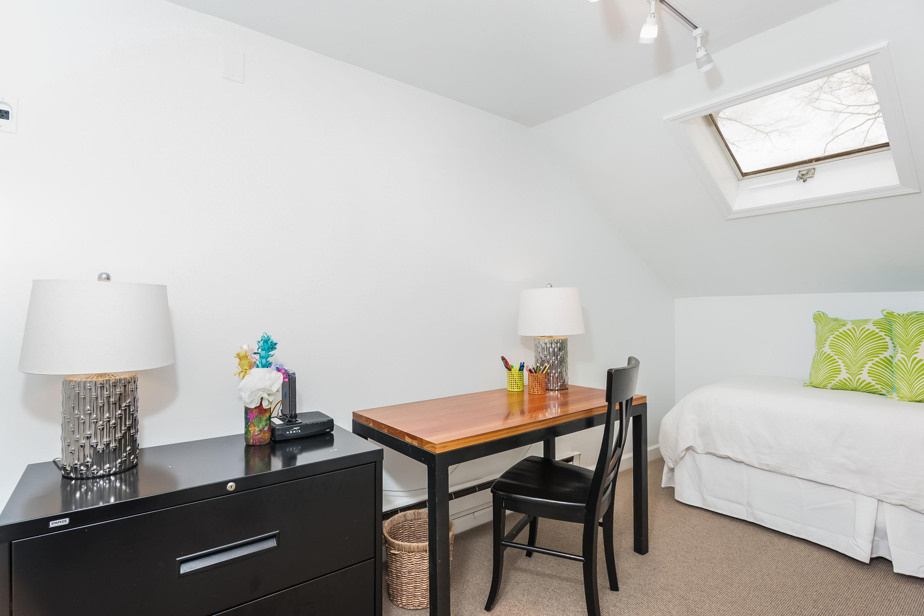 39 Intervale Road Darien, CT 06820 - Photo 11 of 18 a bedroom with a bed and a table in it