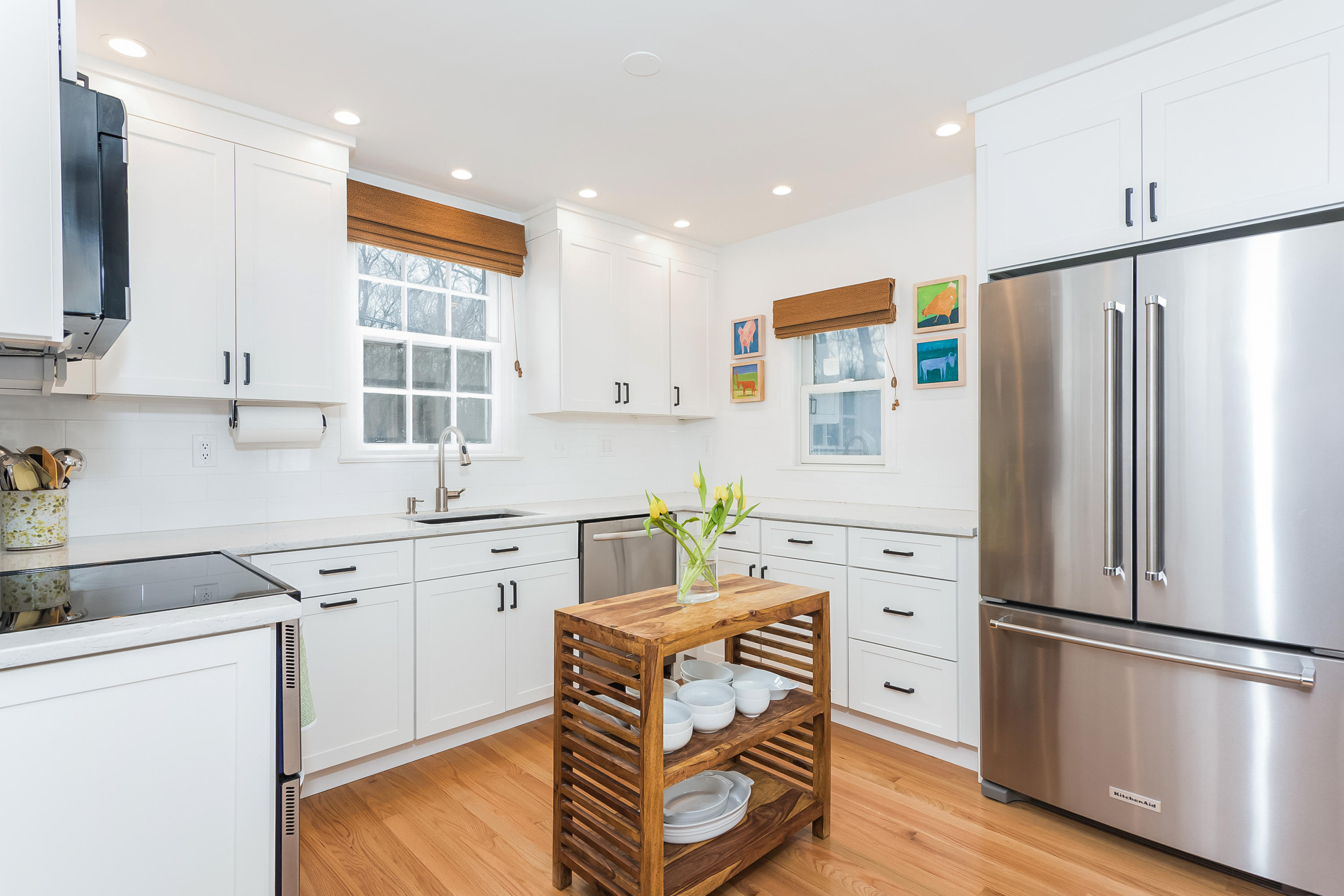 39 Intervale Road Darien, CT 06820 - Photo 5 of 18 a kitchen with a refrigerator cabinets and wooden floor