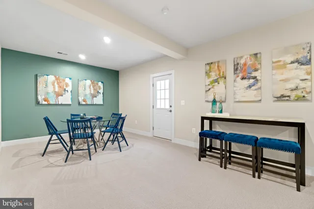 a dining room with furniture and window