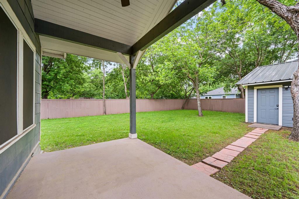 800 North Clements Street Gainesville, TX 76240 - Photo 22 of 27 a view of a backyard with a garden