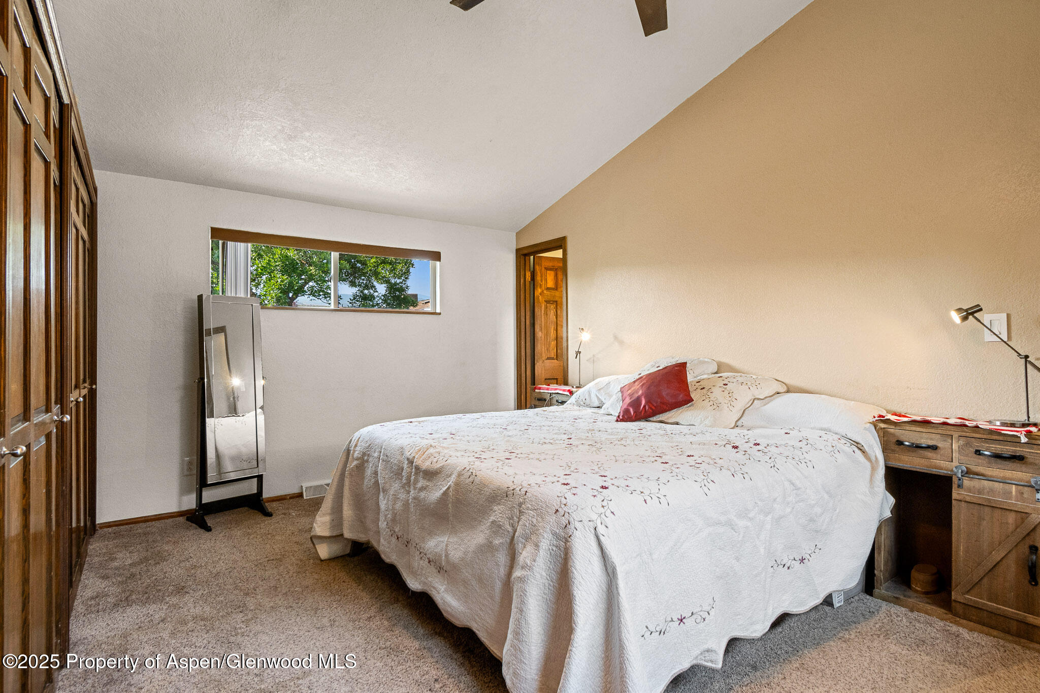 520 Aspen Avenue Rifle, CO 81650 - Photo 25 of 31 a bedroom with a bed and a window