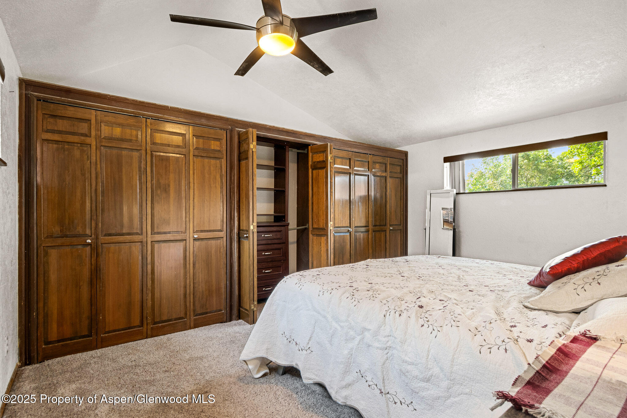 520 Aspen Avenue Rifle, CO 81650 - Photo 7 of 31 a bedroom with a bed and a window