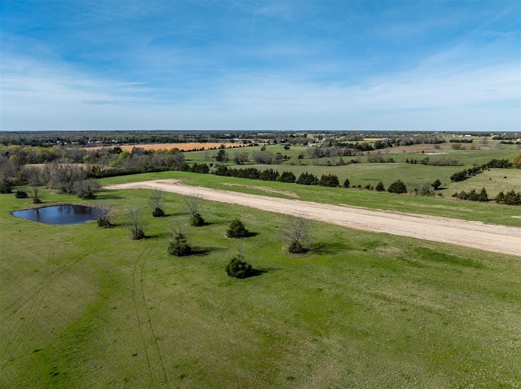 235 Private Road Sumner, TX 75486 - Photo 4 of 8 a view of a lake with a city