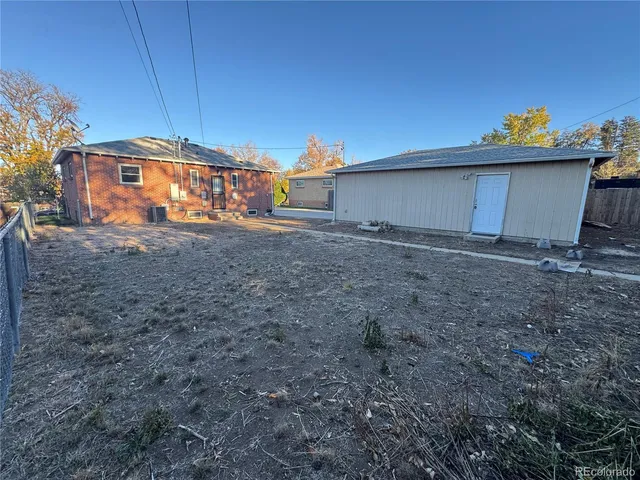 a view of backyard and garage