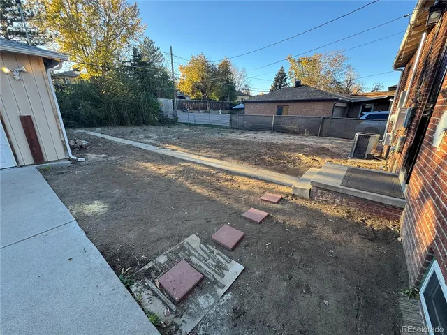a view of a car park in front of house