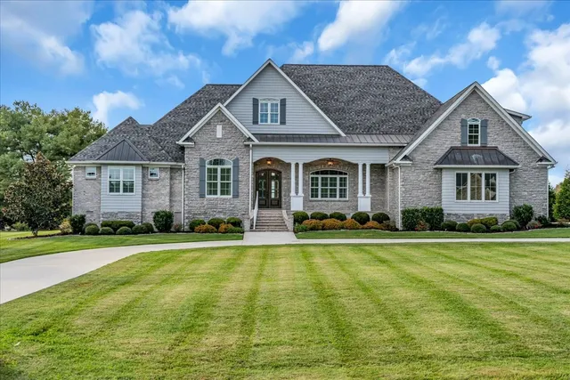 a front view of a house with a yard