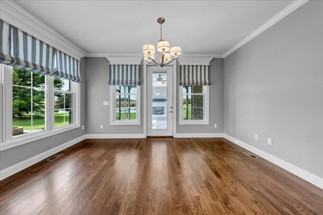 a bathroom with a granite countertop sink toilet a mirror and shower