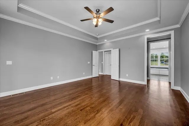 a view of a house with a yard and potted plants