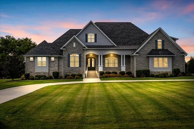 a front view of a house with a yard