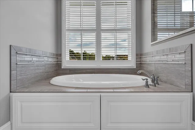 a front view of a house with a yard table and chairs