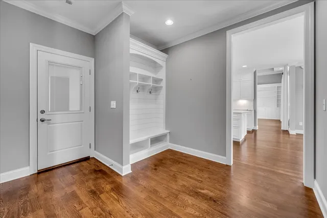 a view of a fountain in front of a house with a big yard
