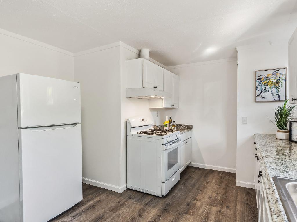 1684 Hill Road Novato, CA 94947 - Photo 13 of 21 a kitchen with a white cabinets and white appliances