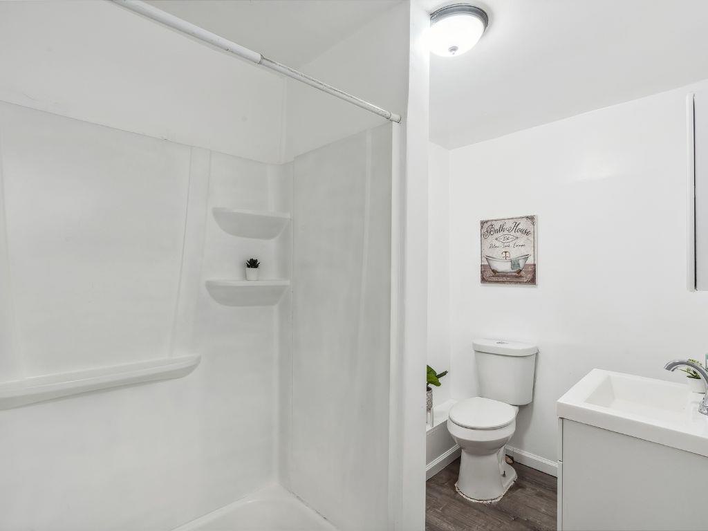 1684 Hill Road Novato, CA 94947 - Photo 18 of 21 a white toilet sitting next to a bathroom sink