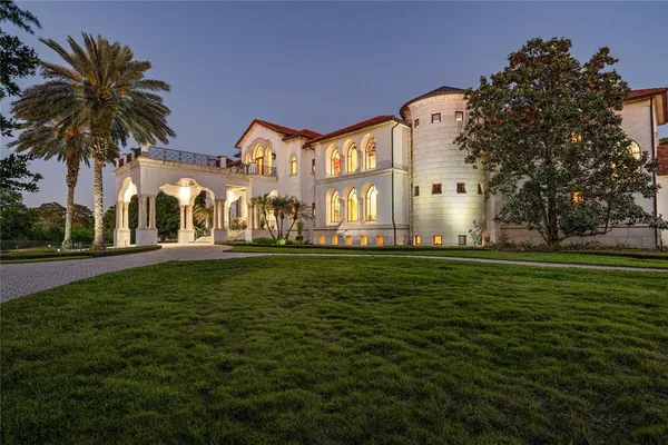 a front view of house with yard and green space