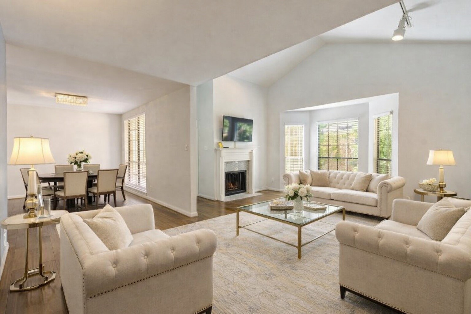 This Beautiful home has an expansive living room boasting a warming fireplace, big bay windows, vaulted ceilings, and the formal dining room. digitally staged