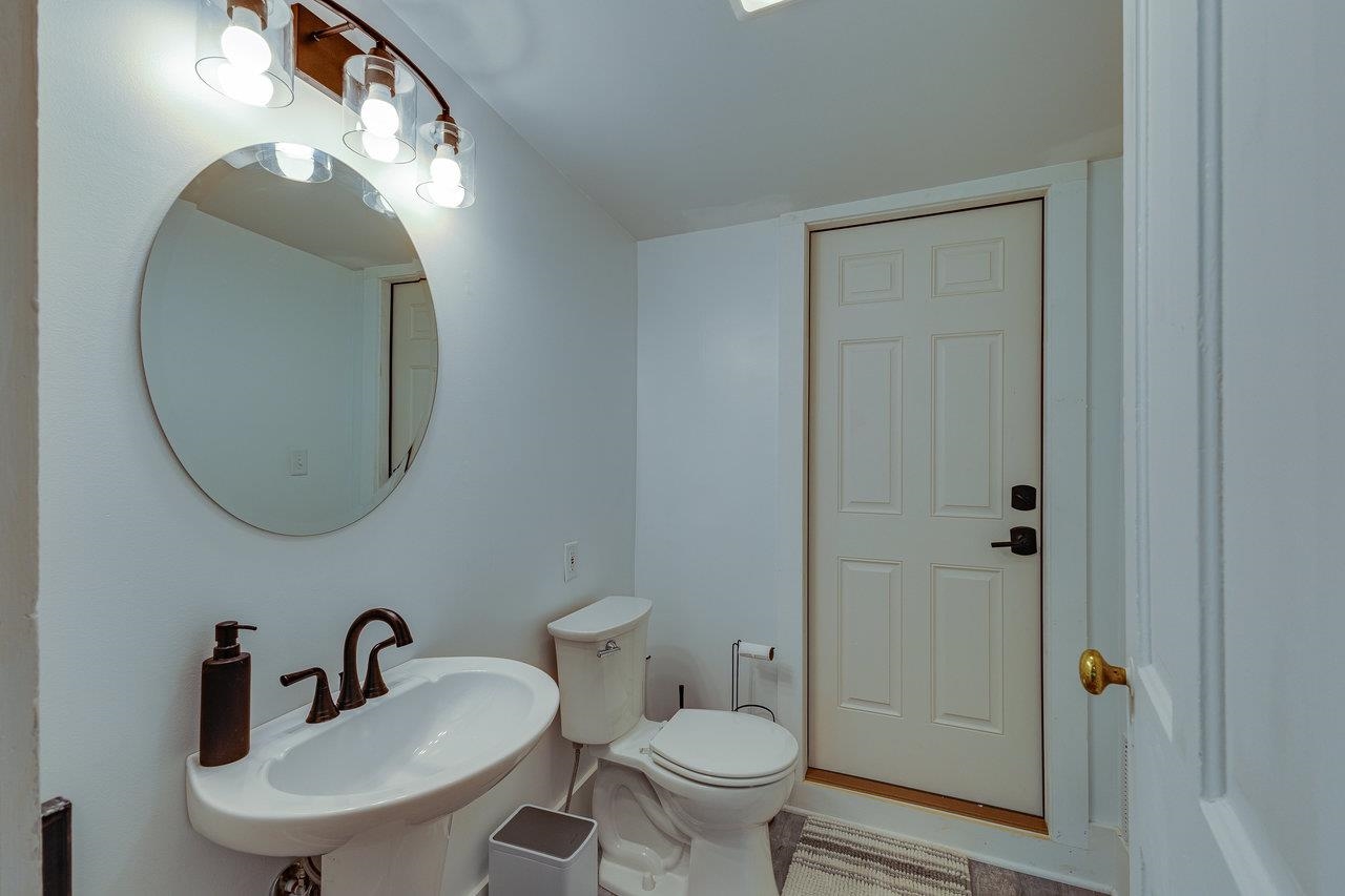 10 Todd Road Mount Sidney, VA 24467 - Photo 18 of 57 a bathroom with a toilet a sink and mirror
