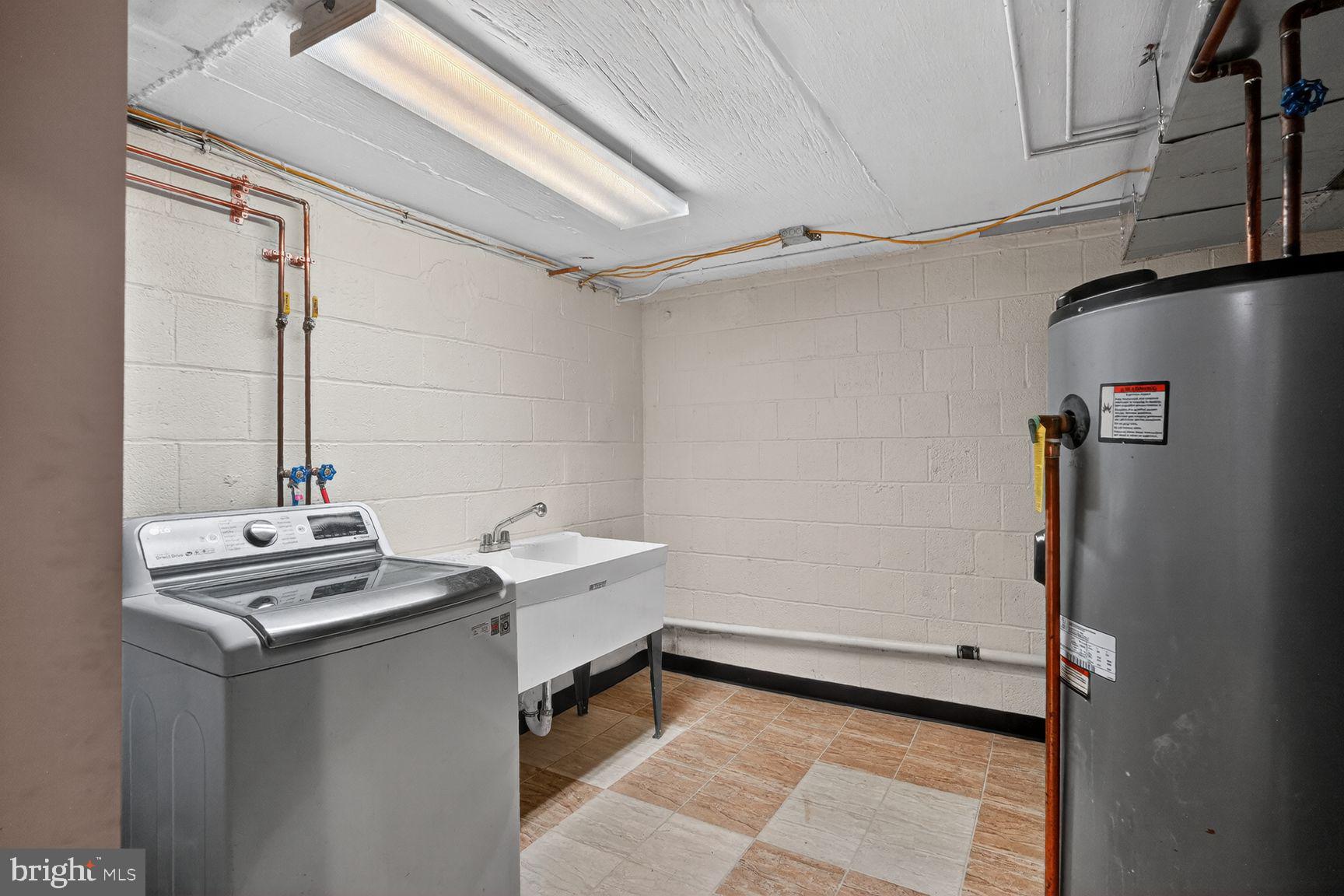4202 Yates Road Beltsville, MD 20705 - Photo 28 of 31 Bright and functional laundry space.
