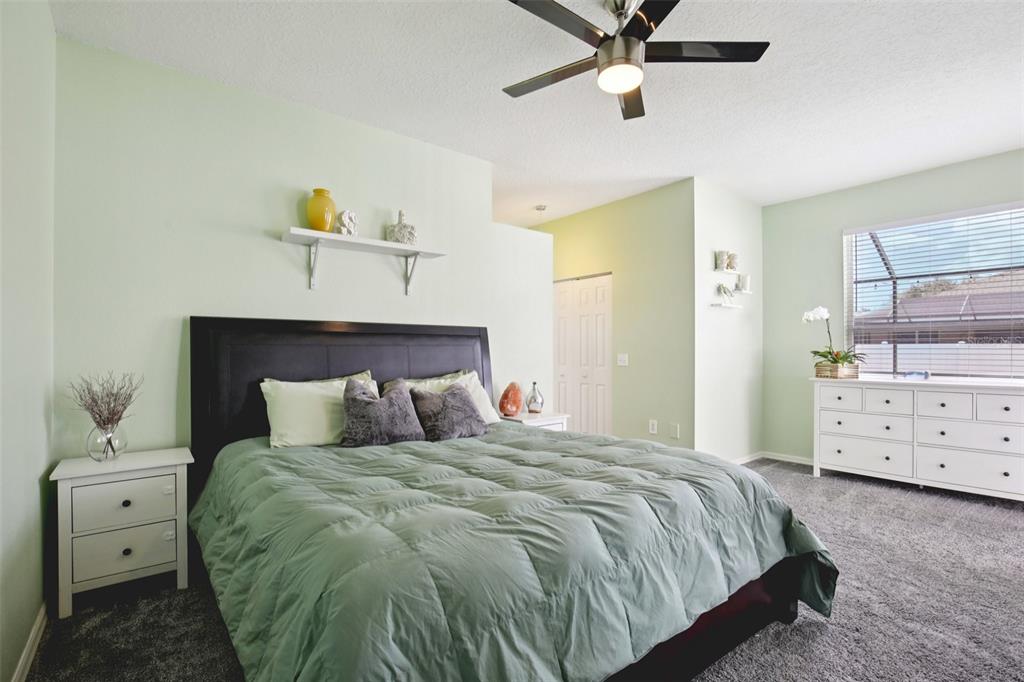 7164 Spikerush Court Lakewood Ranch, FL 34202 - Photo 17 of 36 a bedroom with a bed and window