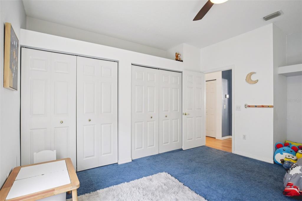 7164 Spikerush Court Lakewood Ranch, FL 34202 - Photo 24 of 36 a view of room with furniture and wooden floor