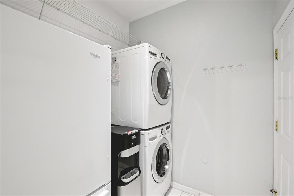 7164 Spikerush Court Lakewood Ranch, FL 34202 - Photo 25 of 36 a utility room with dryer and washer