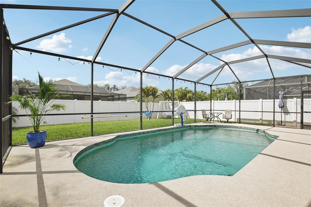 7164 Spikerush Court Lakewood Ranch, FL 34202 - Photo 28 of 36 a swimming pool with view of outdoor seating