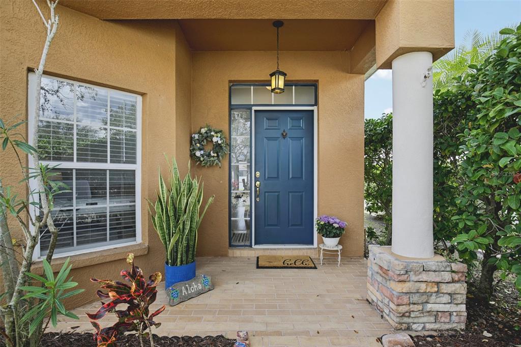 7164 Spikerush Court Lakewood Ranch, FL 34202 - Photo 3 of 36 a front view of a house with a garden