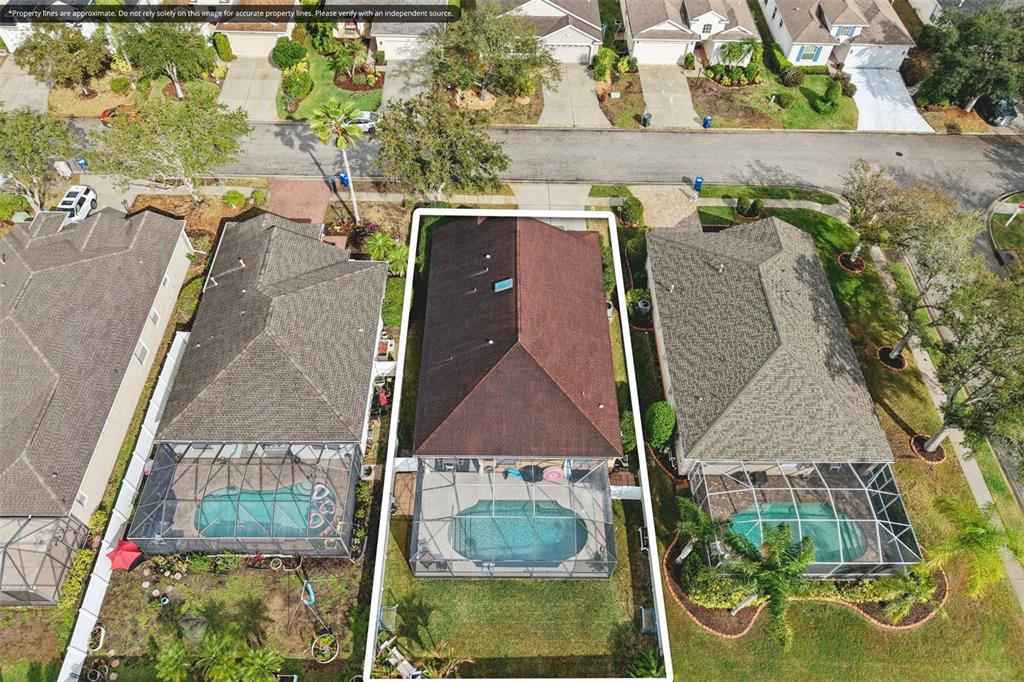 7164 Spikerush Court Lakewood Ranch, FL 34202 - Photo 32 of 36 an aerial view of a house with garden