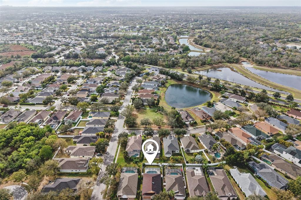 7164 Spikerush Court Lakewood Ranch, FL 34202 - Photo 34 of 36 an aerial view of residential houses with outdoor space