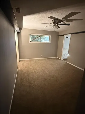 a view of a hallway with a window