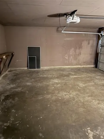 a view of a livingroom with an empty space and a ceiling fan