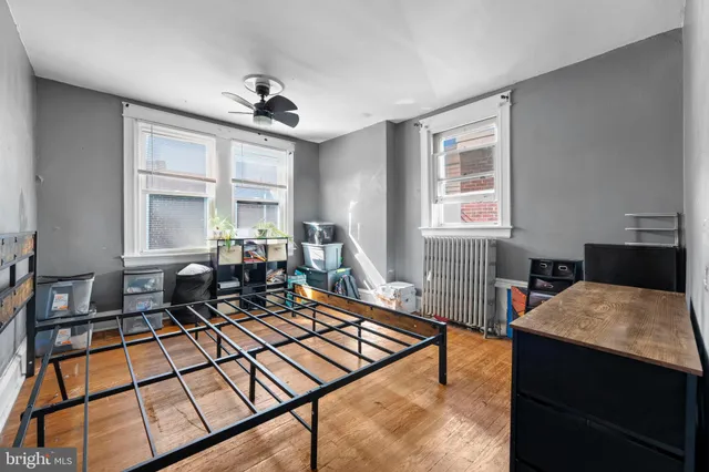 a living room with furniture a window and a table