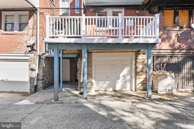 a front view of a house with a garage
