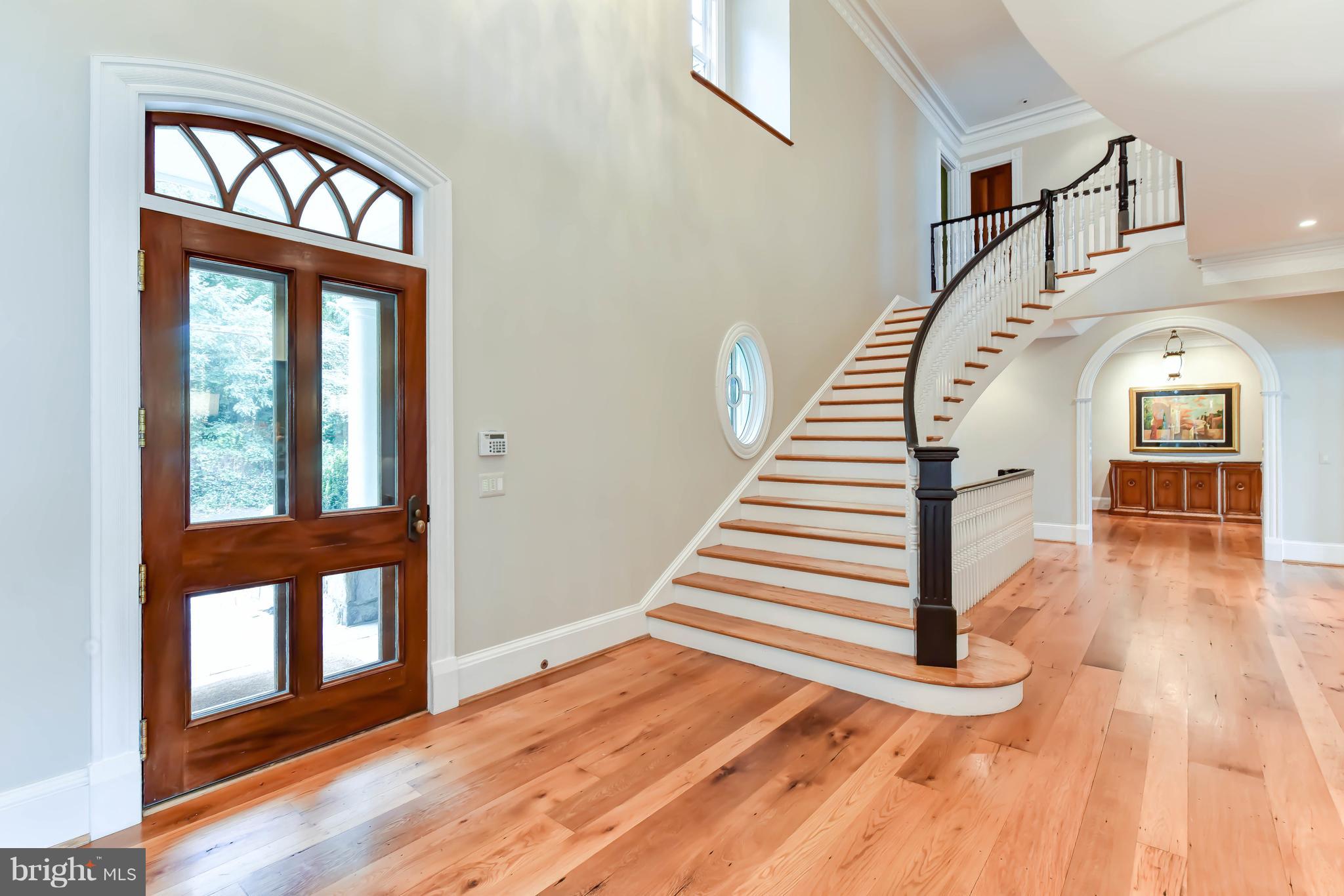 7615 Southdown Road Alexandria, VA 22308 - Photo 9 of 80 Grand Foyer entrance with sweeping staircase