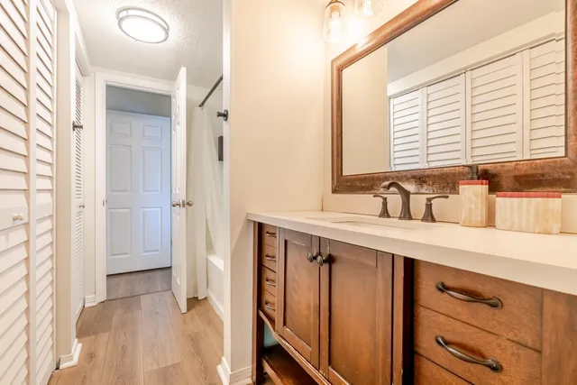 a bathroom with a sink and a mirror