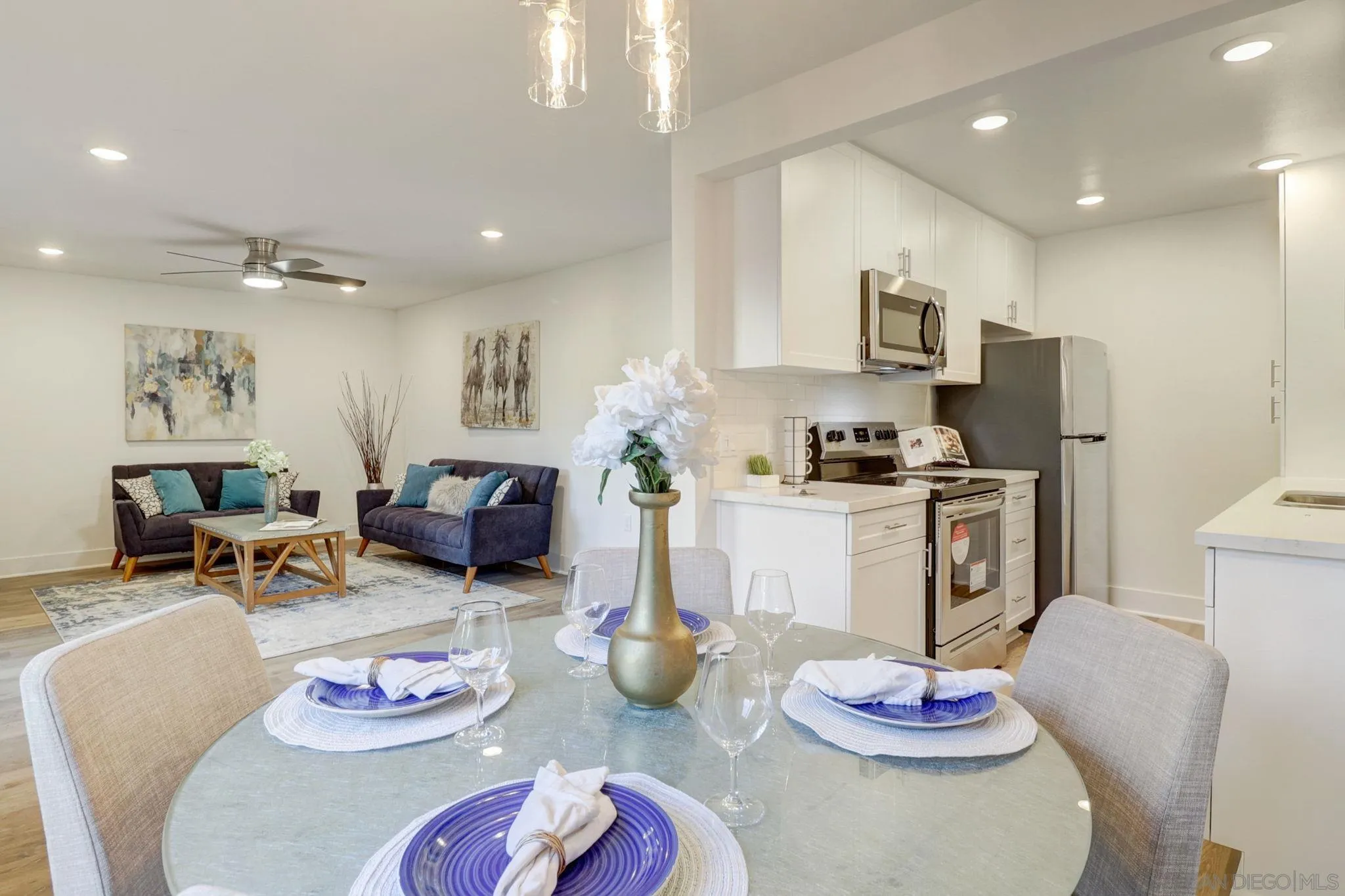 8660 Via Mallorca, Unit B La Jolla, CA 92037 - Photo 11 of 27 a living room with furniture and a kitchen view
