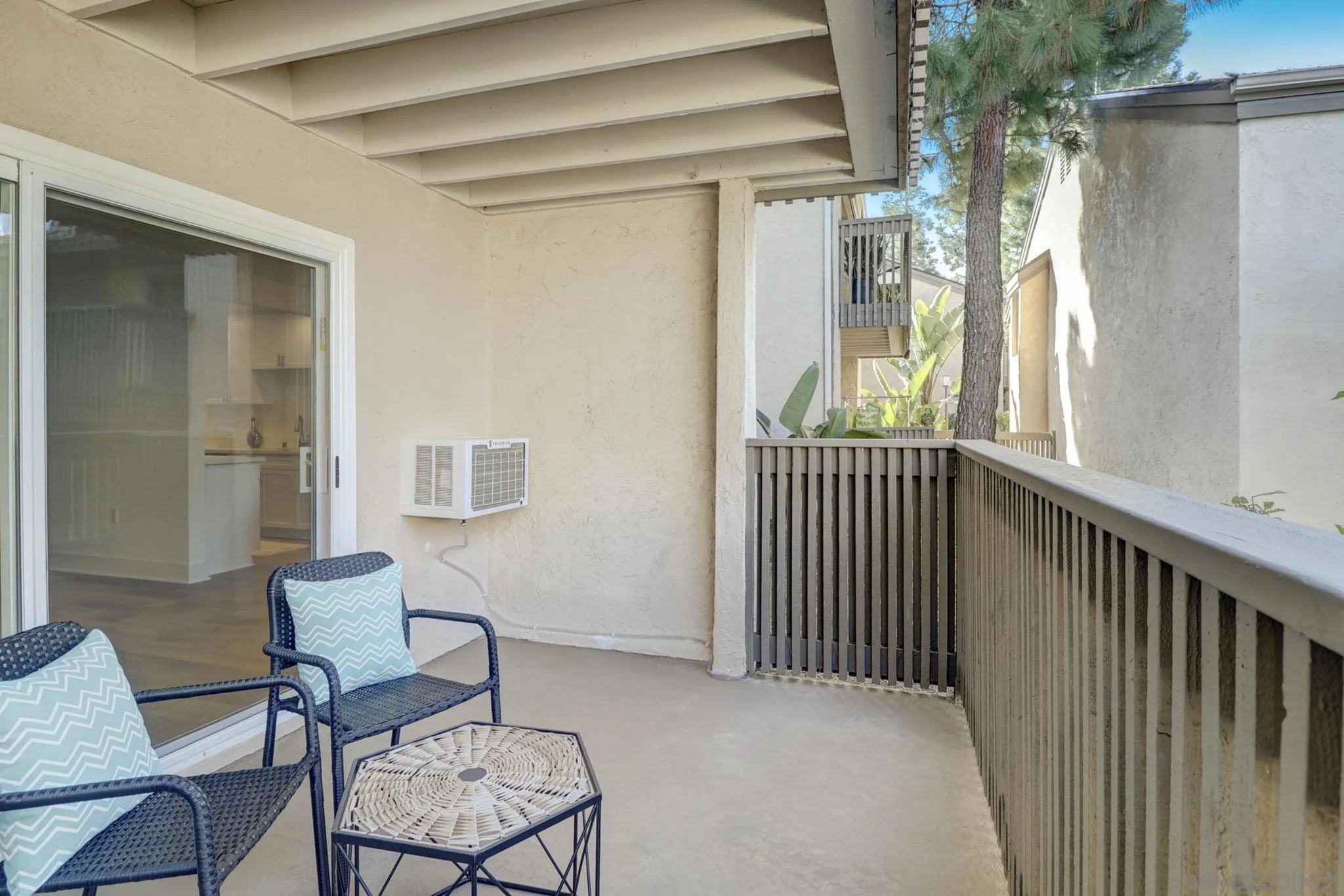 8660 Via Mallorca, Unit B La Jolla, CA 92037 - Photo 17 of 27 a view of a porch with furniture and a window