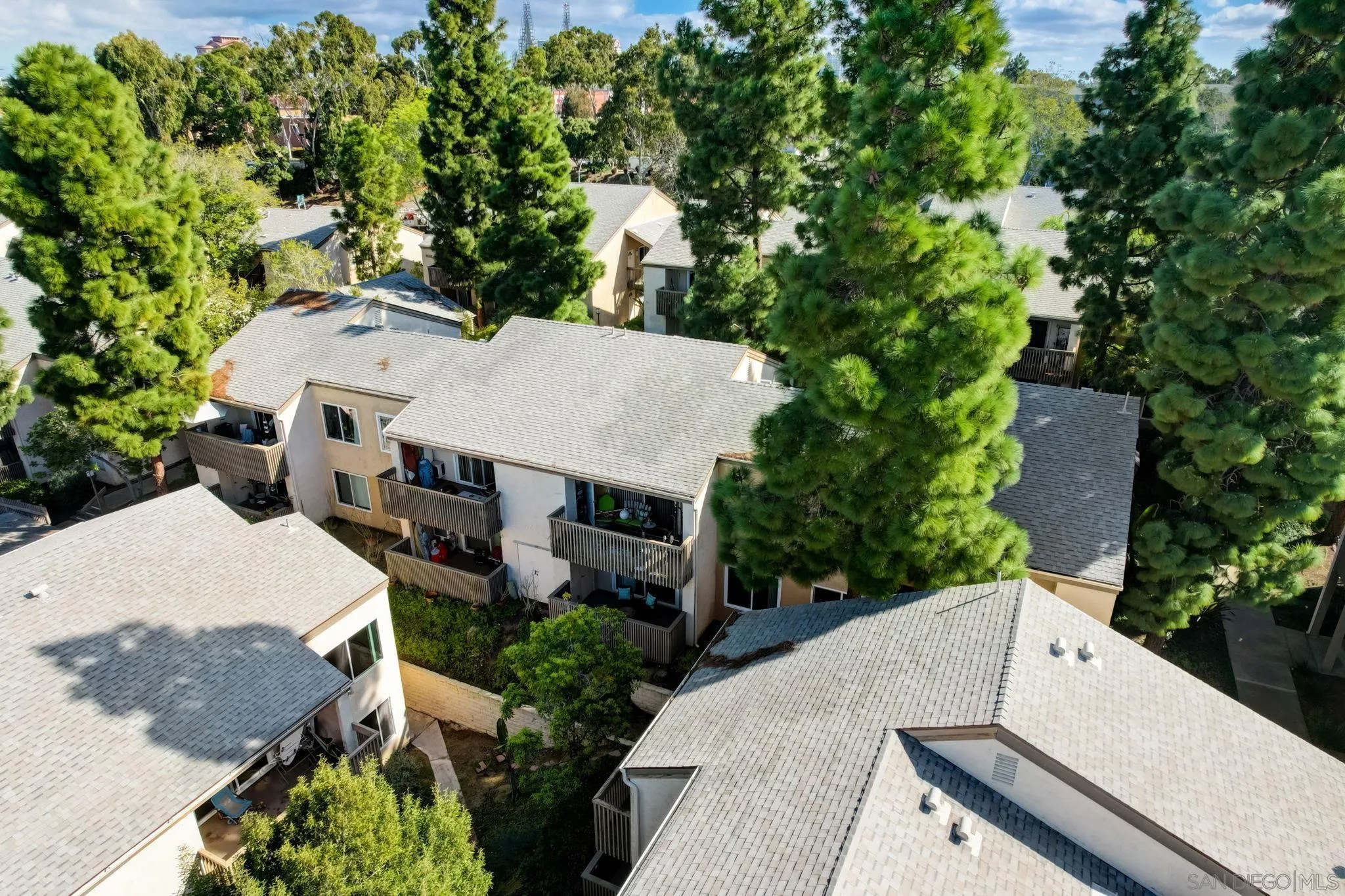 8660 Via Mallorca, Unit B La Jolla, CA 92037 - Photo 26 of 27 an aerial view of a house with yard and outdoor seating